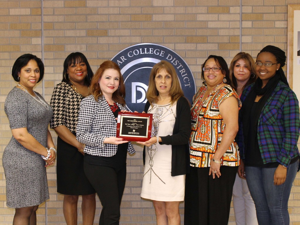Coastal Bend Blood Center representative Leticia Mondragon (center left) presents the 2014 Top Performer Award to Del Mar College administrative assistant Grace Carreon on Wednesday in the Harvin Center on East Campus. Also on hand for the presentation are Cheryl Garner (from left), dean of student engagement and retention; Beverly Cage, director of student leadership and campus life; Bennie Clark, administrative assistant; Blanca Canales, Student Government Association treasurer; and Denise Mugabe, Student Government Association president.