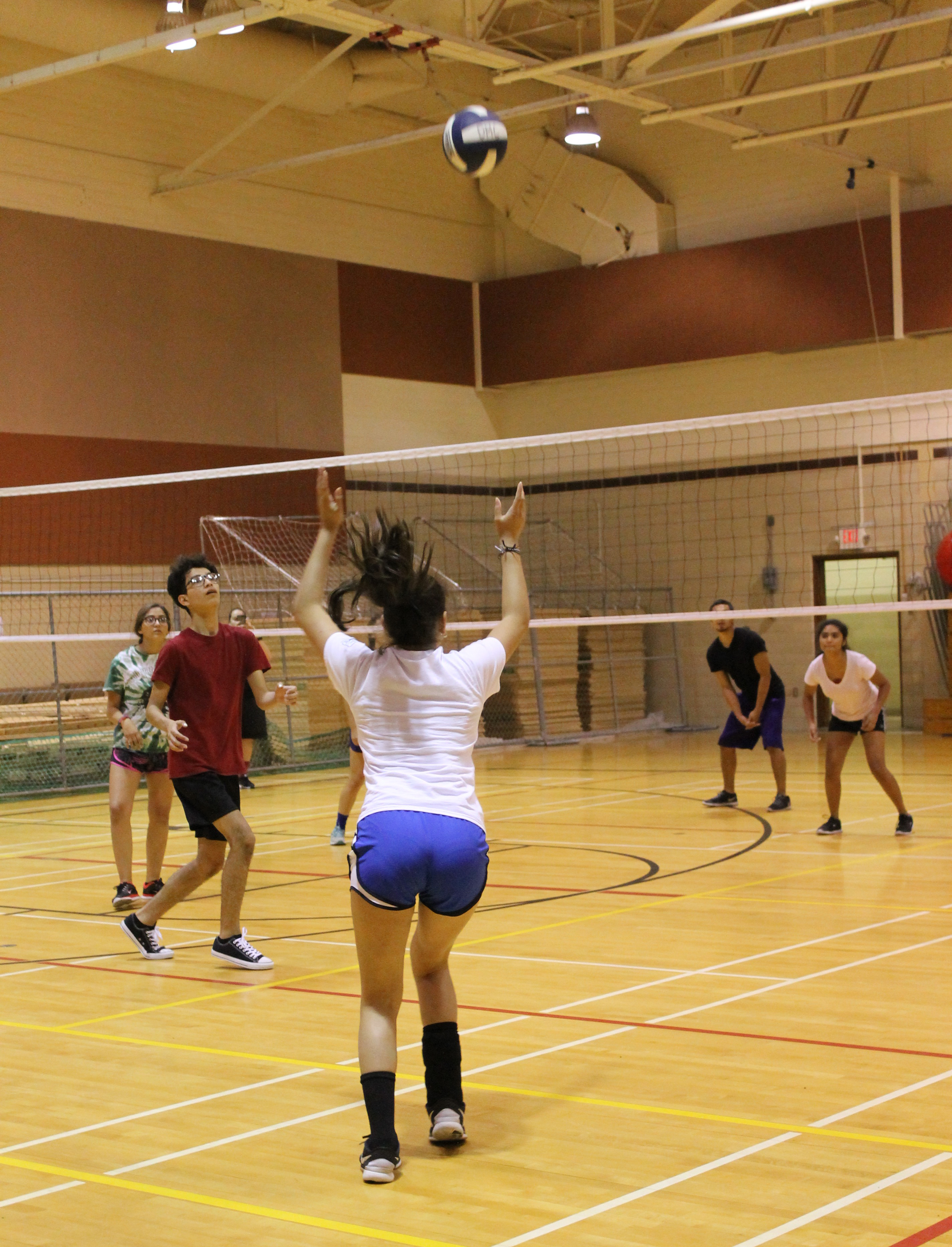 Students compete in the recent intramurals volleyball tournament in the gymnasium on East Campus (photo by Viktoria Ramos) 