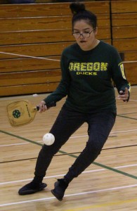 Marissa Enriquez hits ball to advance to her opponent in Picklaball.