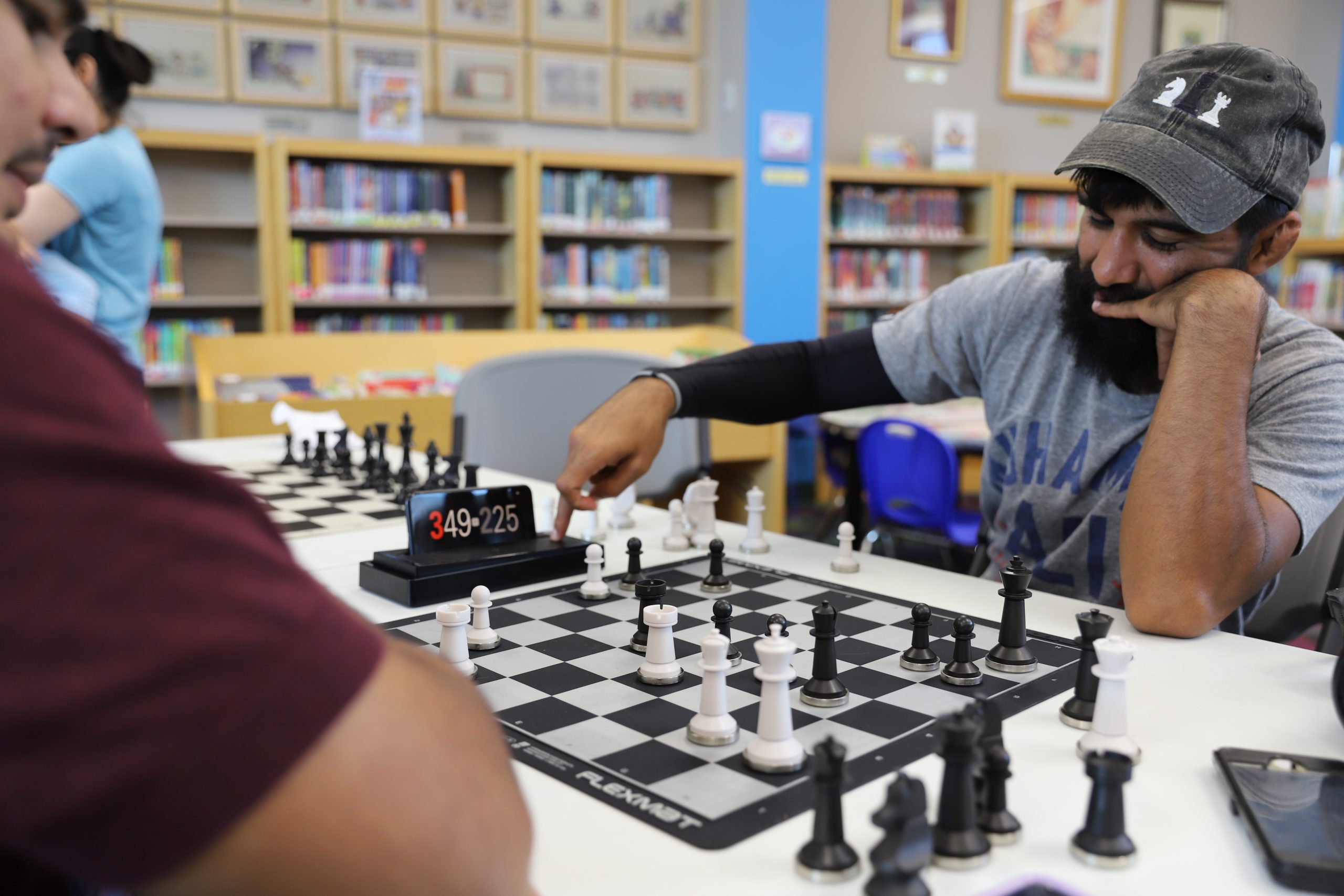 Green Makes Another Move On Chess Board Against Chess Coach Jonathan Rios