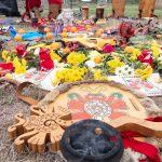 Kalpulli Ehekatl Papalotzin celebrated their 14th anniversary. Members of visitIng kalpullis decorated the emblem of Kalpulli Ehekatl Papalotzin (center) with flowers, fruit, and other elements.