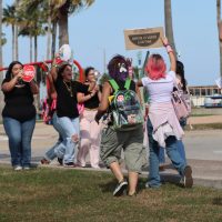 Miller High School students converge with Ray High School students on Shoreline Boulevard on Feb. 12 during a walkout to protest ICE. The groups continued walking toward City Hall.