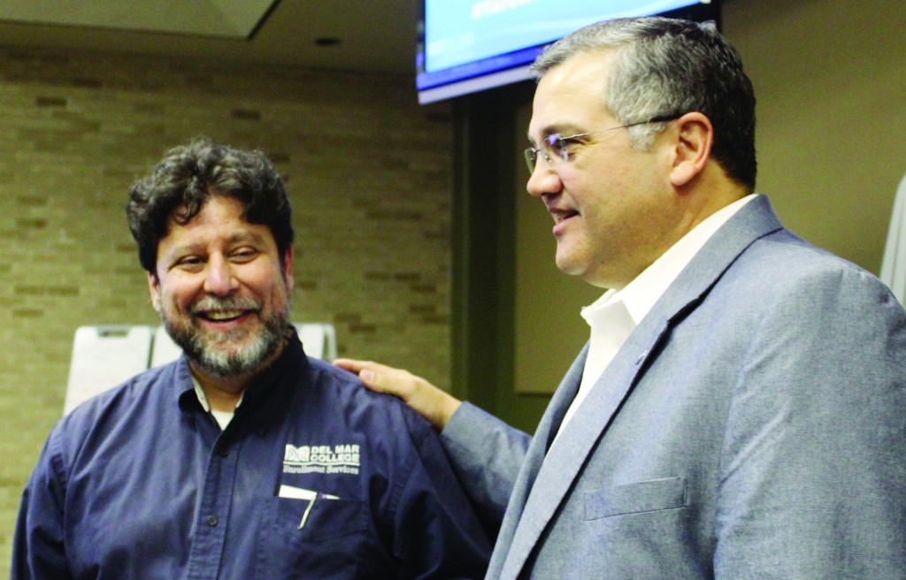Provost Fernando Figueroa (left) and DMC President Mark Escamilla chat at the farewell event.