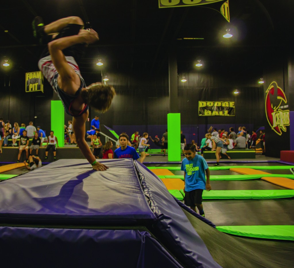 Austin Gustafson, a junior at Veteran's Memorial High School, spends most of his hour at Get Air running up the ramp and using the trampoline for his tricks to the other side. Though many younger kids attempt similar tricks, thick padding throughout the Get Air gym provide a safer fall.