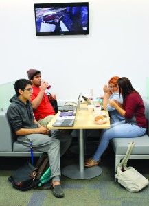 Students relax in the new sleeker booths in the Harvin Center while they break in between classes.