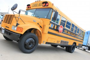A school bus sits patiently as it waits to be used for safety training.