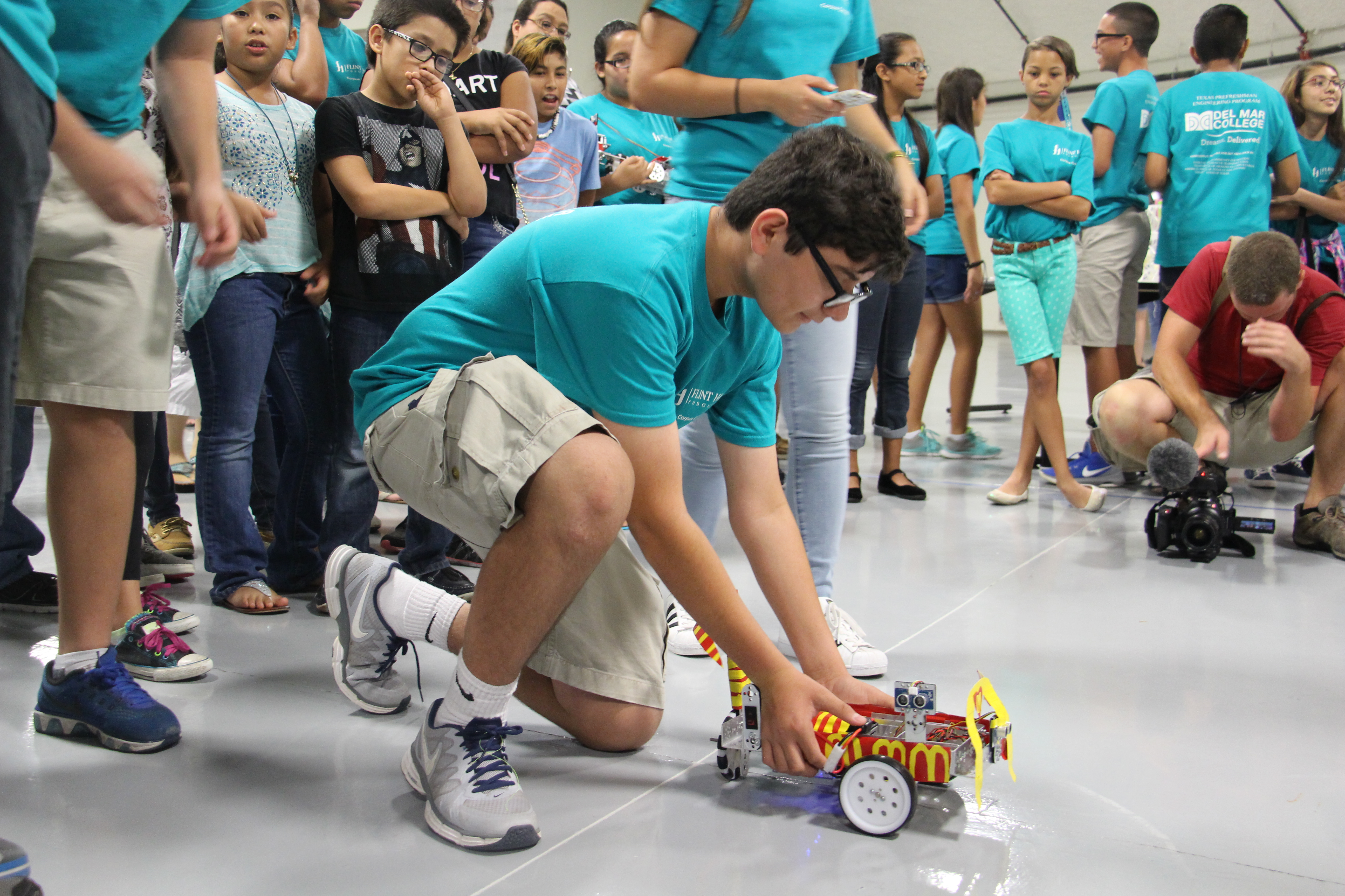 Youngsters create, race robots