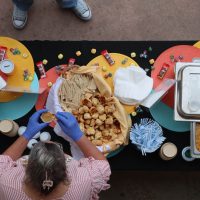 Sojourners table serving souper bowl attendees bisuits and soup