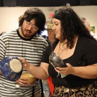 Geniva Martinez (right) boyfriend (left) shopping for ceramic bowls at souper bowl 2026 event