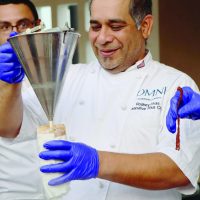 OMNI Executive Cheif Rodney Livas serving SOUPer bowl attendees