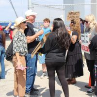 Attendees of Trump event (Left) Deanna Olesinky interacting with protesters (from left to right) Kimberly Ramirez, Lily Riggs, Amanda (no last name given).