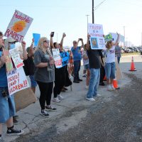 Protesters of President Donald J. Trumps arrival, (from left to right) Heidi Riggs, and Lily Riggs.
