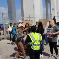 Attendees of Trump event (Left) Deanna Olesinky interacting with protesters (from left to right) Kimberly Ramirez and Lily Riggs.