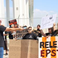 Attendees of Trump event speaking with protesters (center) Amanda, no last name given.