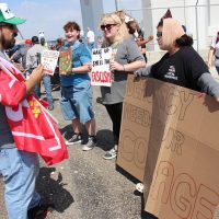 Ray Reys, a Trump Supporter speaking with protesters (from left to right) Heidi Riggs, Lily Riggs, and Amanda (no last name given).