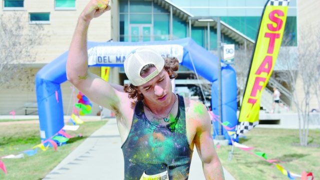 Revel Wick, two-time winner of the DMC Color Run, poses after completing. Photo by Rogelio Garcia