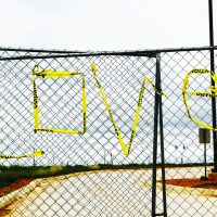 Dilley Detention protestors tore off caution tape and used it to write LOVE on the entrance into the facility