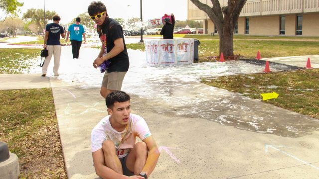 Runners take a break following the Color Run on Del Mar's Heritage Campus on March 4. Photo by Victor Herrera.