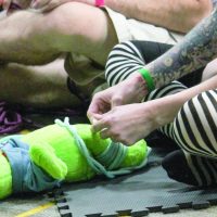 Aug 15 2027, an atteendee practicing ties of the Shibari rope play class "Rope Lab 101" taught by Knotty Futos and Tease, of Borderland Bondage.